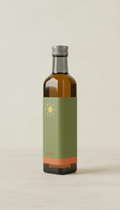 Cold-pressed oil, Use a 3/4 angle for product shots to highlight the packaging design and contents. The background should...
