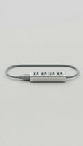 Sleek extension cord, Single product isolated on a matte surface (white or pale grey), shot at a three-quarter angle to...